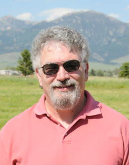 spangler standing with mountains behind